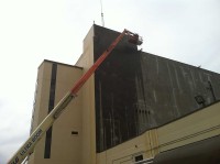Rodgers & Sons preps an exterior of an industrial building to prepare for repainting